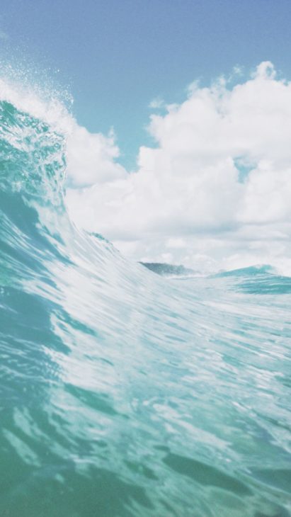 Deep green sea big waves and clean beach iphone wallpaper